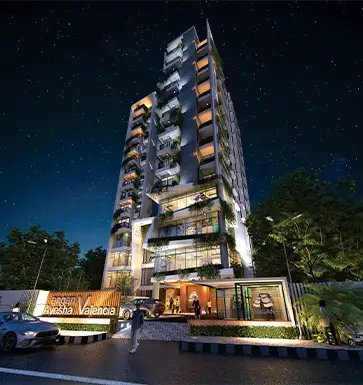 Luxury apartments in Mirpur, Dhaka – modern high-rise Valencia tower illuminated at night with green balconies and elegant lighting.